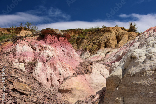 the fantastically-colored and eroded pink and white hoodoos of paint mine,on a sunny day near calhan, el paso county, colorado photo