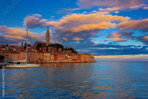 Wonderful morning view of old Rovinj town with multicolored buildings and yachts moored along embankment, Croatia.