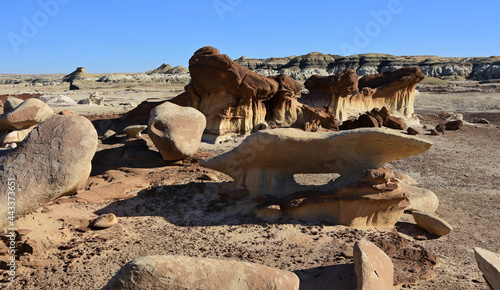 the natural  bisti arch on a sunny winter day in the alamo wash section of the bisti badlands near farmington, new mexico photo