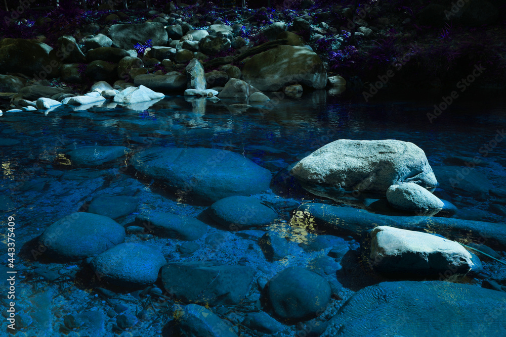 Fototapeta premium Big and small stones arranged naturally beautiful. in the waterfall area with blue water in the national park