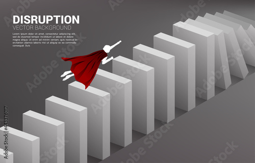 Silhouette of superhero fly over to the domino collapse. Concept of business industry disrupt