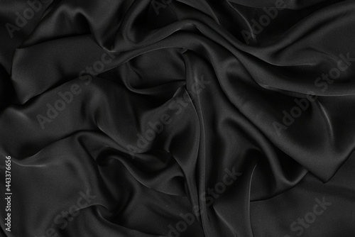Smooth elegant silk or satin luxury cloth texture can use as wedding background. Luxurious background design.