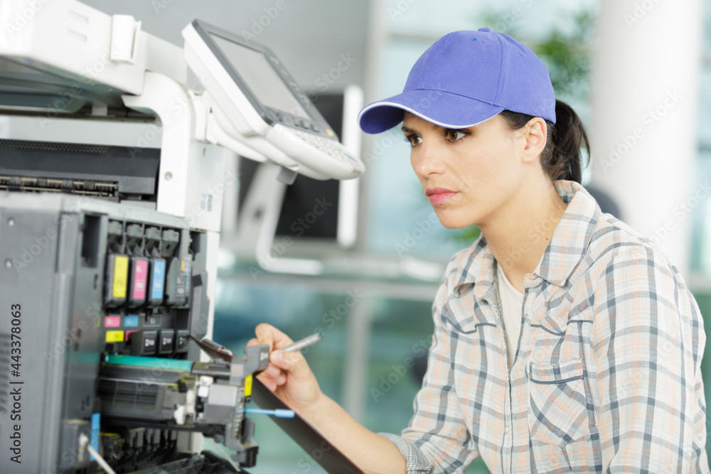 happy young woman on printer maintenance happy young woman on printer maintenance