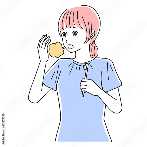 口臭を気にする女性