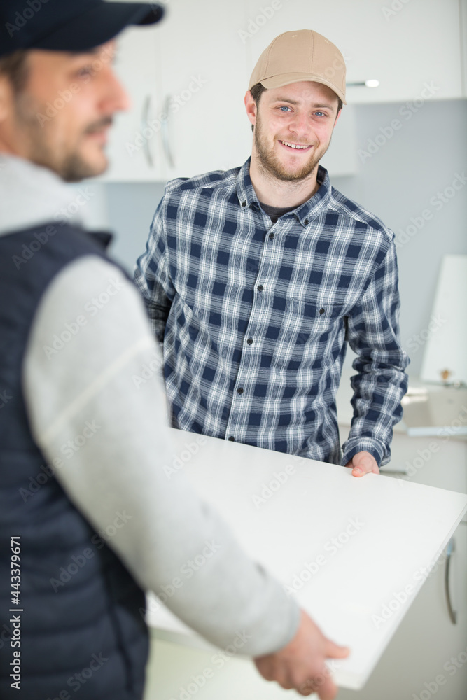 smiling handyman construction of a kitchen smiling handyman construction of a kitchen