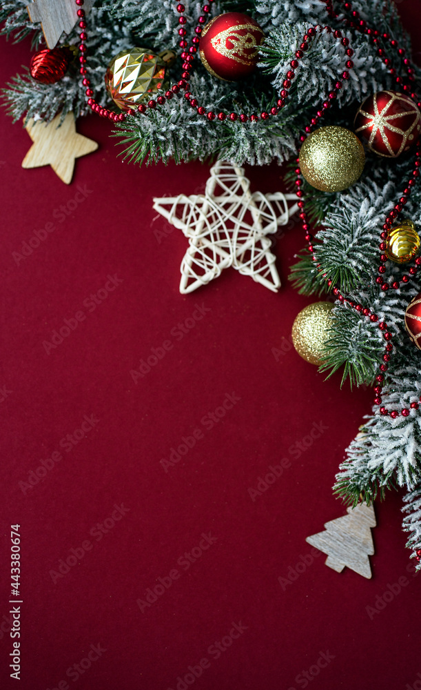 New Year's composition. Gold and red balls, star on a red background. Place for your text. New Year's composition. Gold and red balls, star on a red background. Place for your text.