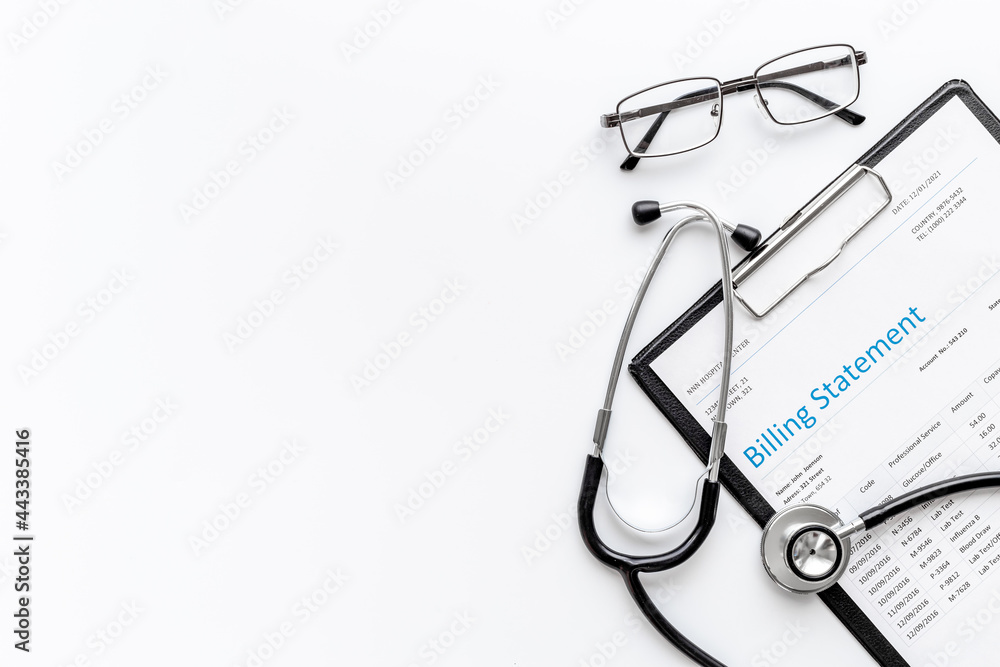 Medical billing statement with stethoscope. Top view Medical billing statement with stethoscope. Top view