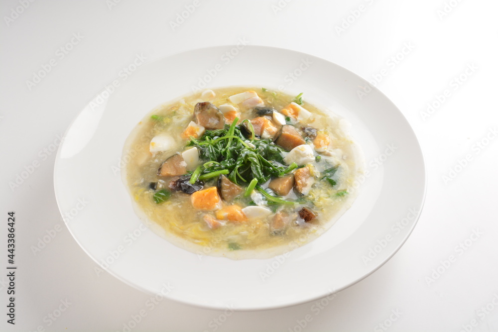 stir fried water spinach vegetable with trio eggs in thick gravy sauce in white plate asian halal menu