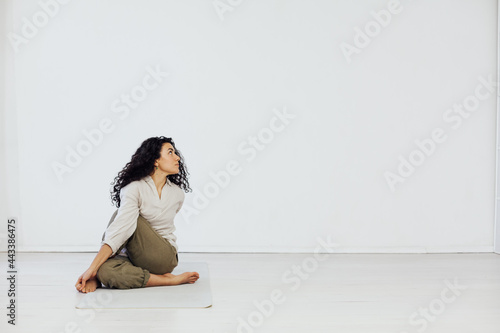 Beautiful fitness brunette woman engaged with yoga asana gymnastics