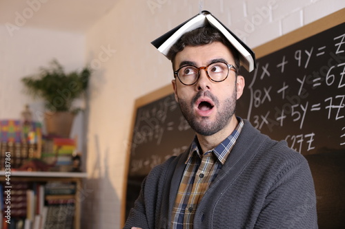 Fotografie Teacher absorbing information from book using telepathy