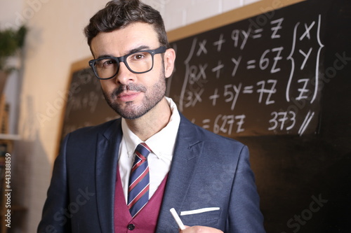 Tablou pe pânză Young man in posh uniform with academic background