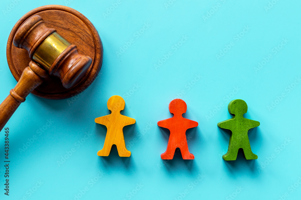 Mediator conflict resolving. Judge gavel with wooden figures arbitrator between opponents Mediator conflict resolving. Judge gavel with wooden figures arbitrator between opponents