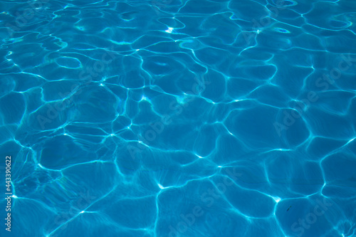 blue water surface in the swimming pool  water in the pool. horizontal background for summer concept.