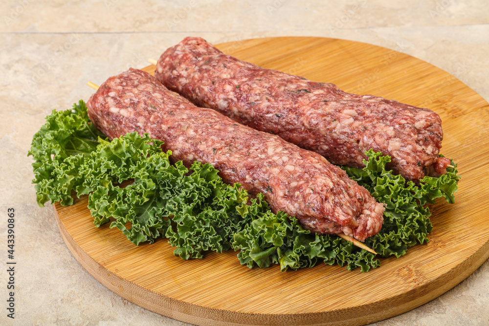 Raw minced beef kebab skewer