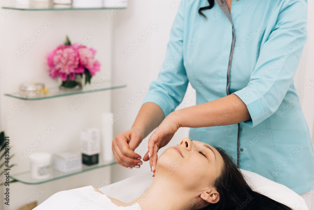Face Massage in beauty spa salon. Beauty Treatments. Body care, skin care, wellness, wellbeing, beauty treatment concept. Spa facial Massage Face Massage in beauty spa salon. Beauty Treatments. Body care, skin care, wellness, wellbeing, beauty treatment concept. Spa facial Massage