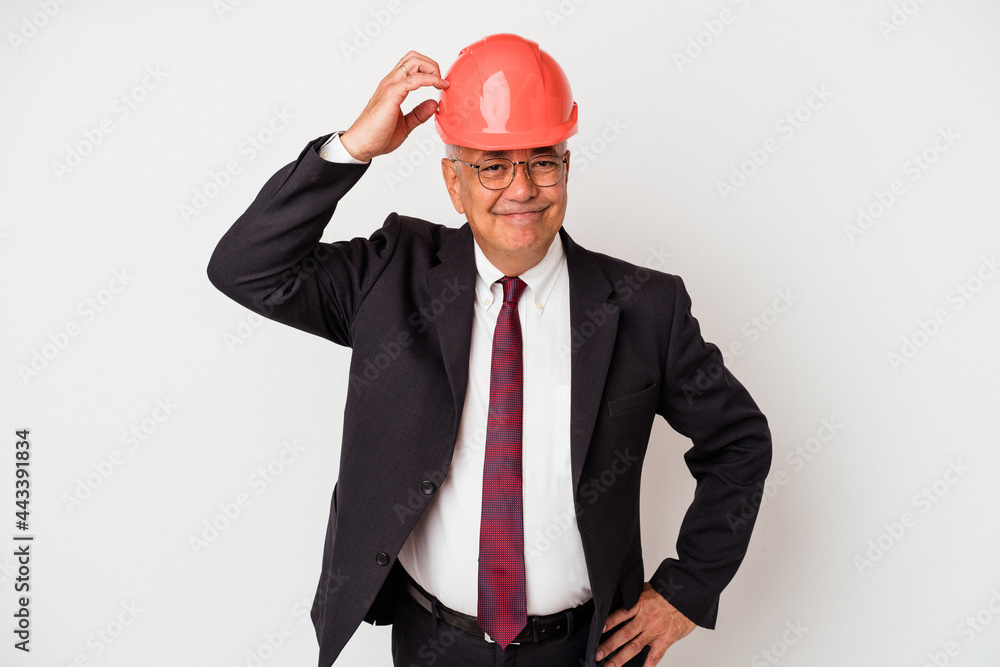 Senior american arquitech man isolated on white background being shocked, she has remembered important meeting. Senior american arquitech man isolated on white background being shocked, she has remembered important meeting.