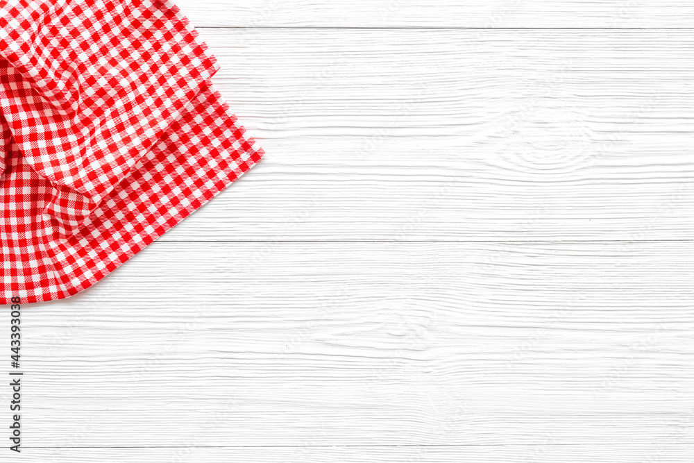 Red picnic cloth on wooden table, top view Red picnic cloth on wooden table, top view