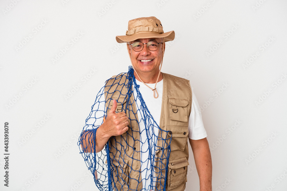 Senior american fisherman holding net isolated on white background smiling and raising thumb up Senior american fisherman holding net isolated on white background smiling and raising thumb up