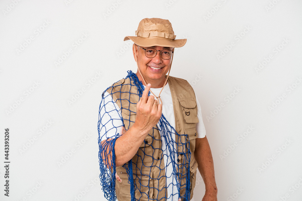Senior american fisherman holding net isolated on white background pointing with finger at you as if inviting come closer. Senior american fisherman holding net isolated on white background pointing with finger at you as if inviting come closer.