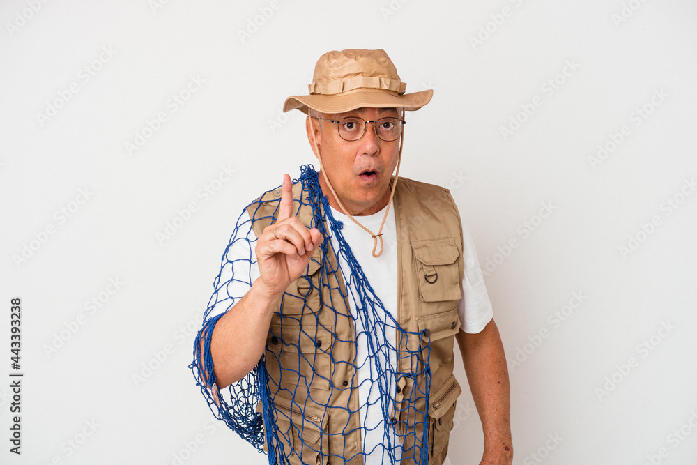 Senior american fisherman holding net isolated on white background having an idea, inspiration concept. Senior american fisherman holding net isolated on white background having an idea, inspiration concept.
