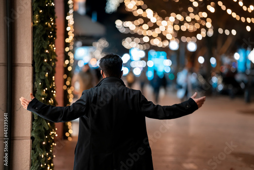 Evening hope , An elegant man opens his hands to life with lights