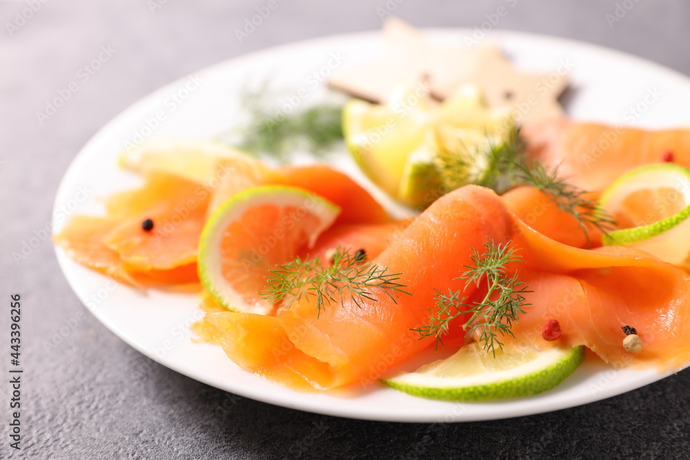 slice of smoked salmon and lemon