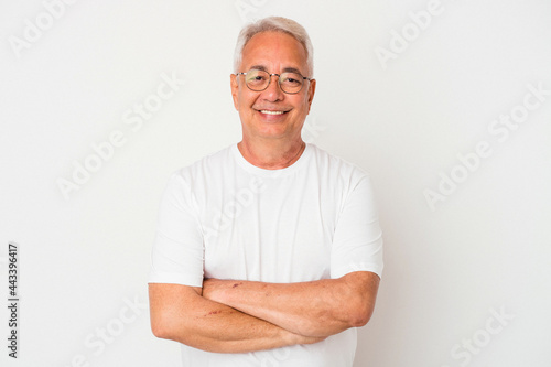 Senior american man isolated on white background who feels confident, crossing arms with determination.