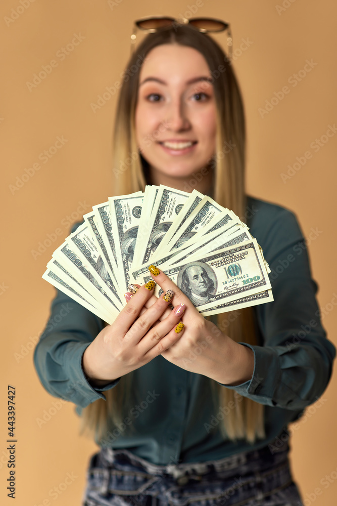 woman holds cash money in dollar banknotes woman holds cash money in dollar banknotes