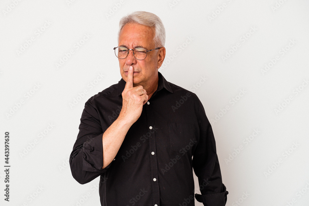 Senior american man isolated on white background thinking and looking up, being reflective, contemplating, having a fantasy. Senior american man isolated on white background thinking and looking up, being reflective, contemplating, having a fantasy.