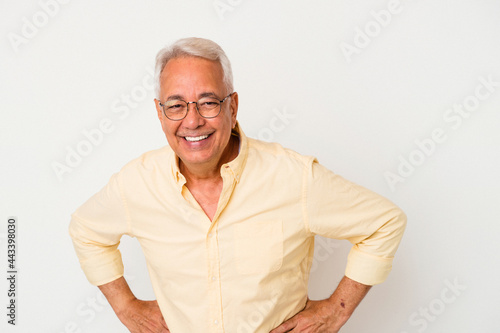 Senior american man isolated on white background happy, smiling and cheerful.