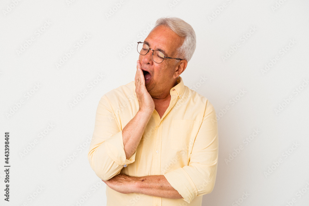 Senior american man isolated on white background yawning showing a tired gesture covering mouth with hand. Senior american man isolated on white background yawning showing a tired gesture covering mouth with hand.