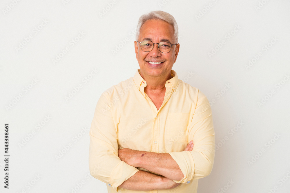 Senior american man isolated on white background who feels confident, crossing arms with determination. Senior american man isolated on white background who feels confident, crossing arms with determination.