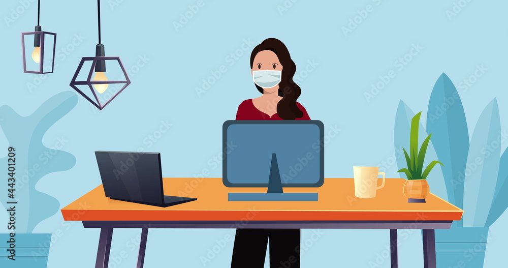 Image of woman in face mask working using computer