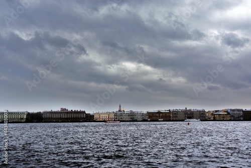 View of Saint Petersburg historical city center and the Neva river from Peter and Pauls fortress, Russia. Dramatic sky clouds. © Ekaterina Bykova