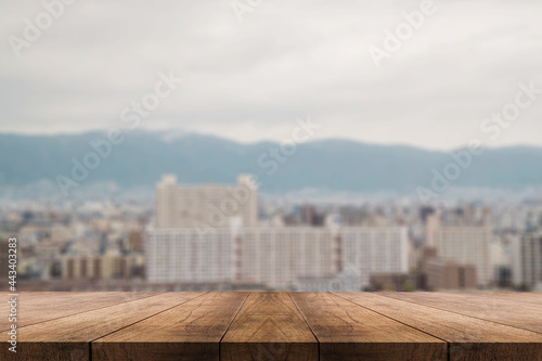 3D rendering, wooden top table on isolate light and blurred background 