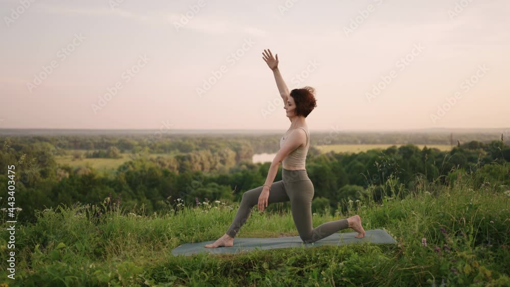 A yoga master performs various exercises and movements for balance and soul development while standing in the forest mountains early in the morning in slow motion A yoga master performs various exercises and movements for balance and soul development while standing in the forest mountains early in the morning in slow motion