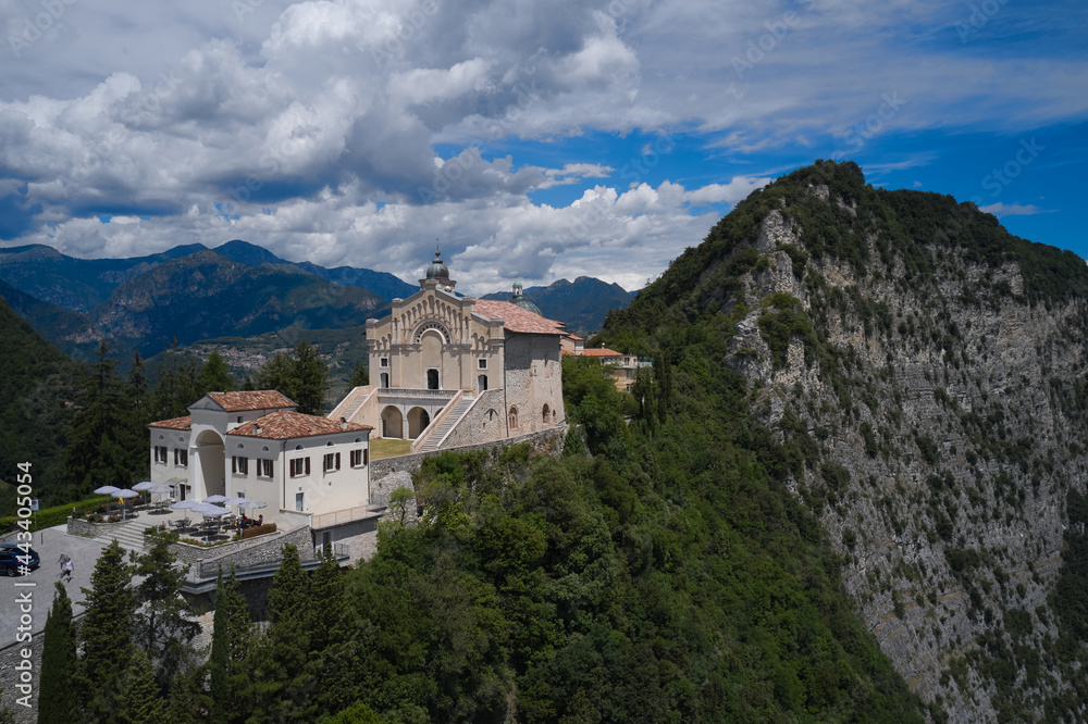 Panorama Eremo di Montecastello, Italy aerial view. Historic catholic church on the mountain, background of the Alps. Aerial panorama of the historic church Eremo di Montecastello on Lake Garda.