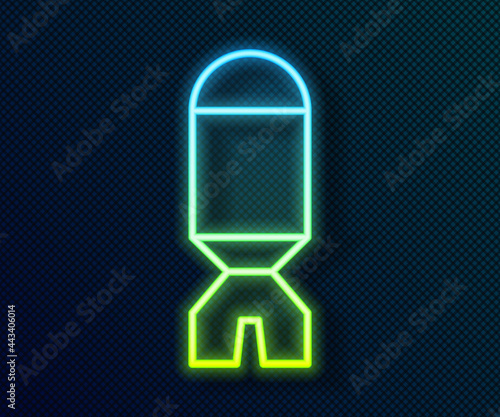 Glowing neon line Rocket launcher with missile icon isolated on black background. Vector