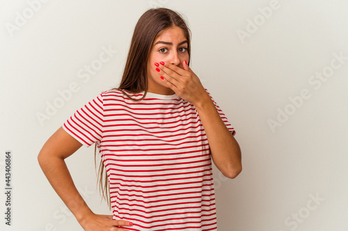 Young caucasian woman isolated on white background having a liver pain, stomach ache.