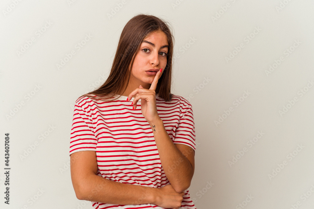 Young caucasian woman isolated on white background looking sideways with doubtful and skeptical expression. Young caucasian woman isolated on white background looking sideways with doubtful and skeptical expression.