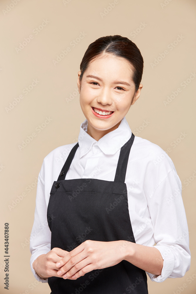 Portrait of asian waitress beaufitul female is posing in the studio with happy smiling at isolate blank empty background studio Portrait of asian waitress beaufitul female is posing in the studio with happy smiling at isolate blank empty background studio
