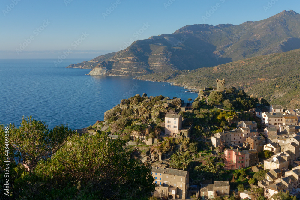 View of  the village of Nonza with its Genoese tower, Cap Corse in Corsica, France
