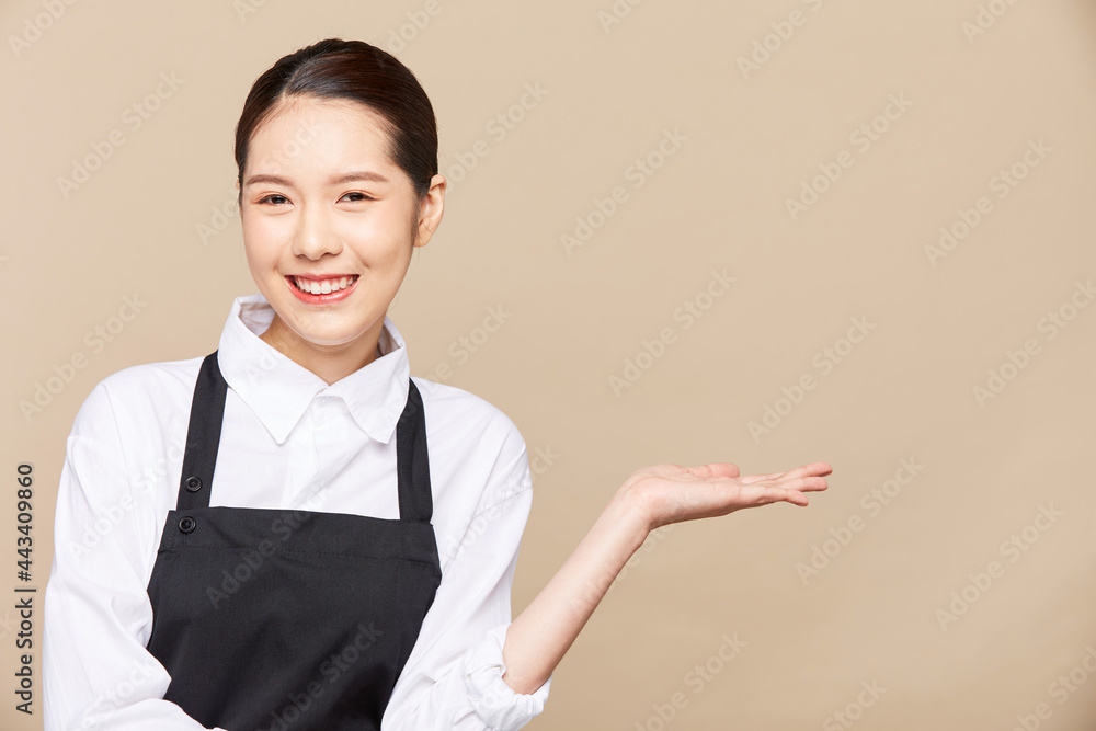 Portrait of asian waitress beaufitul female is howing OK hand gesture with happy smiling at isolate blank empty background studio Portrait of asian waitress beaufitul female is howing OK hand gesture with happy smiling at isolate blank empty background studio