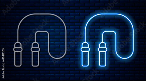 Glowing neon line Jump rope icon isolated on brick wall background. Skipping rope. Sport equipment. Vector