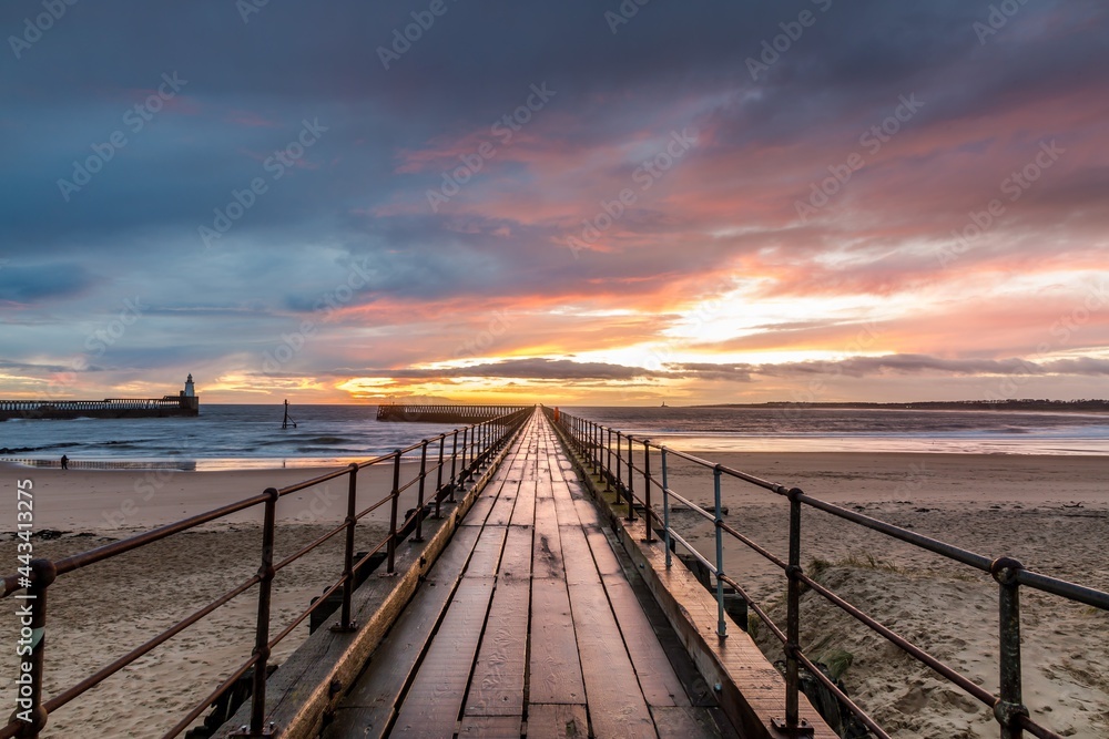A glorious morning at Blyth beach, with a beautiful sunrise over the old wooden Pier stretching out to the North Sea