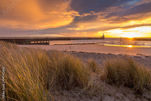 A glorious morning at Blyth beach  with a beautiful sunrise over the old wooden Pier stretching out to the North Sea