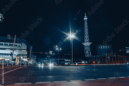 Photography Messe Berlin, Messe Damm in Berlin Germany at night with radio tower in Backgrou