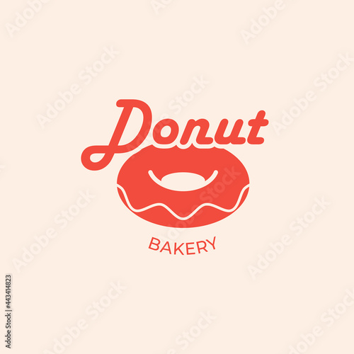 Minimalist logo or emblem for donut shop and bakery. Bright vector design with bitten donut. Identity. Business Card.