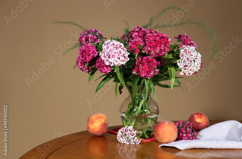 Wallpaper Mural A vase with summer flowers and peaches on a beige background Torontodigital.ca