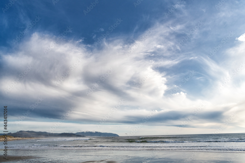 view on beach with sea or ocean water. cloudy sky and seascape nature.
